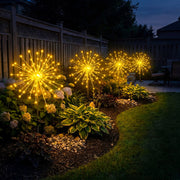 Solar starburst stake lights adding glow beside a patio