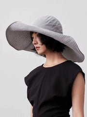 Blue gray UPF wide brim sun hat styled outdoors
