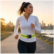 Reflective waist belt worn by a runner in morning light