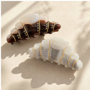 Pearl cream and espresso croissant hair claw color options