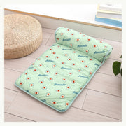 Green foldable pet cooling mat styled indoors