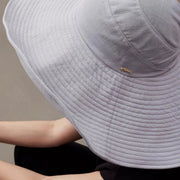 Close detail of the blue gray foldable sun hat stitched brim